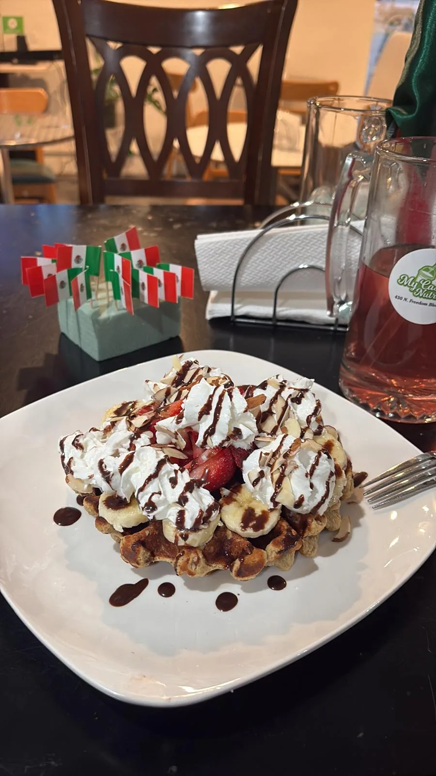 Protein waffle with whipped cream and almonds at My Casa Nutrition